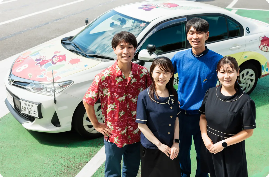 Instructors and students beside a training car