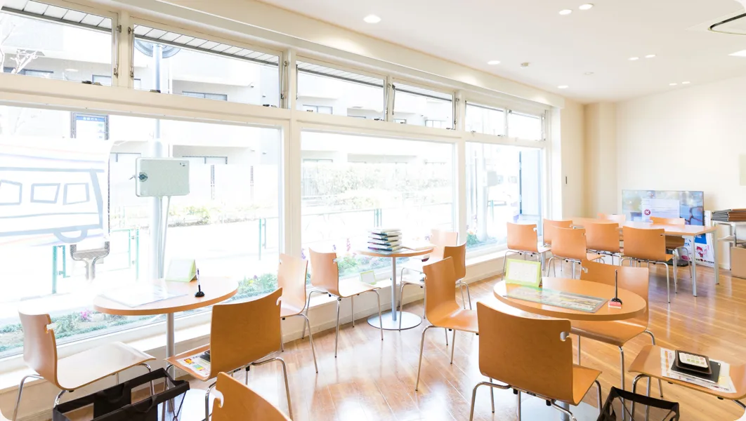 The school lobby with tables beside a window