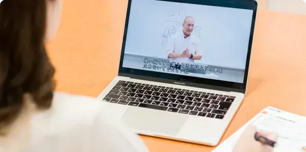 Student taking an online lesson on a laptop