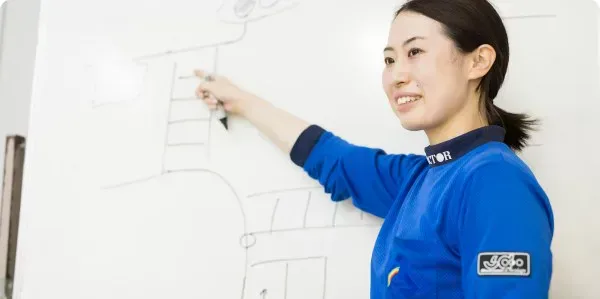 Instructor explaining a route on a whiteboard