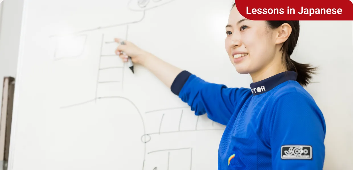 Instructor explaining a route on a whiteboard