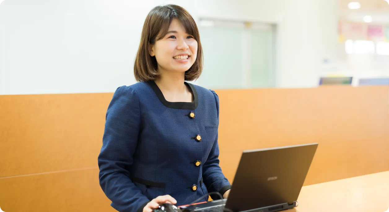 Reception staff member at a laptop
